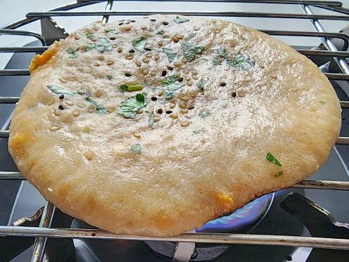 toasting kulcha on fire