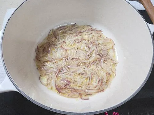 red onions frying in ghee for dum ka chicken