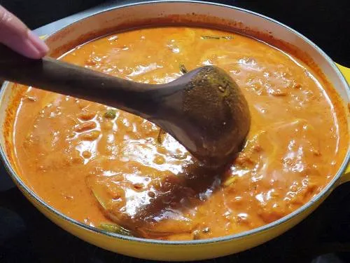 pushing the fish into liquid