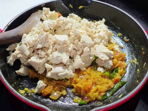 adding crumbled tofu