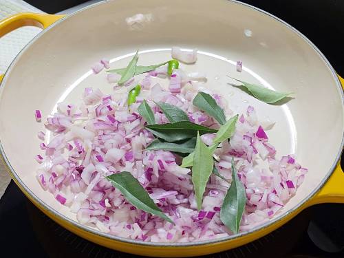 sauteing onions to make shrimp curry