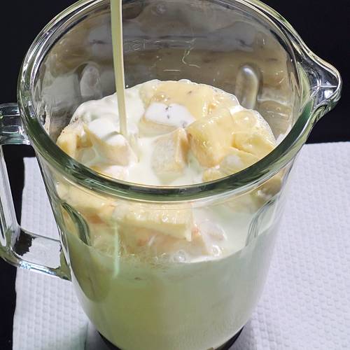 adding ingredients to a blender